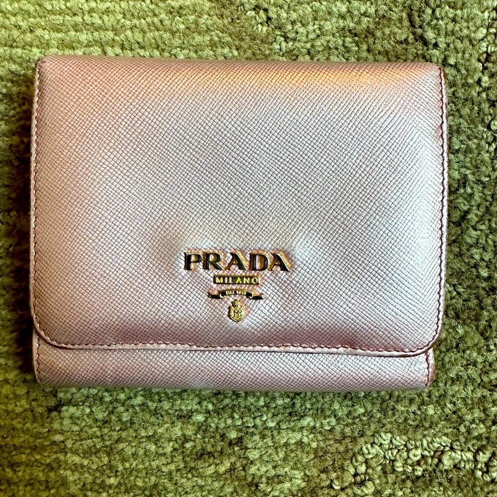 Prada small metallic pink trifold wallet with saffiano leather.